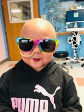 Alayna in hospital with glasses and lipstick.jpg