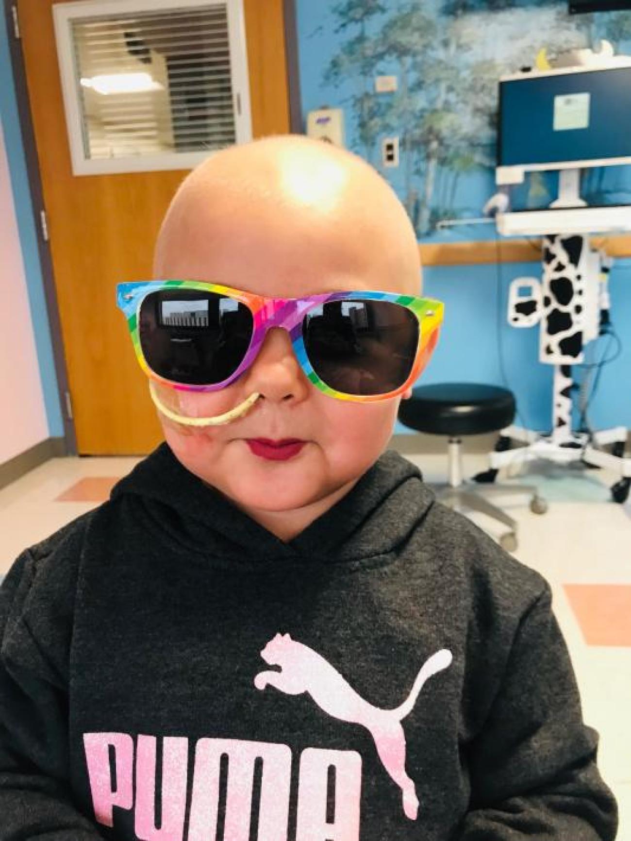 Alayna in hospital with glasses and lipstick.jpg